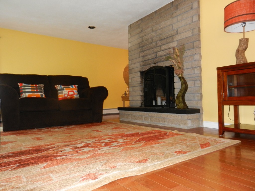 40 Indian Run Road Bellingham, MA 02019 - Photo 6 of 15 a living room with furniture and a fireplace