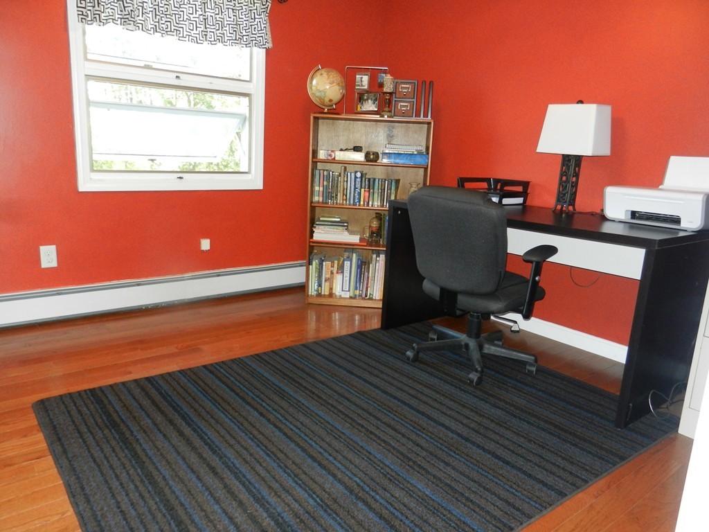 40 Indian Run Road Bellingham, MA 02019 - Photo 8 of 15 a workspace with furniture and lamp