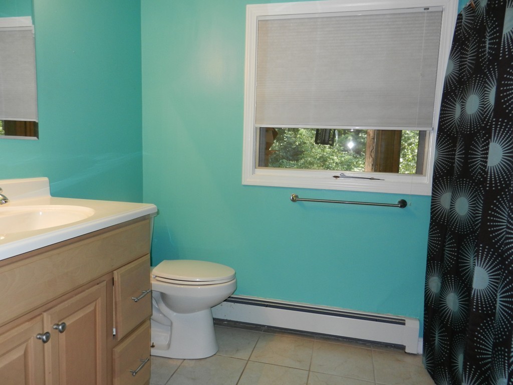 40 Indian Run Road Bellingham, MA 02019 - Photo 9 of 15 a bathroom with a sink and a toilet