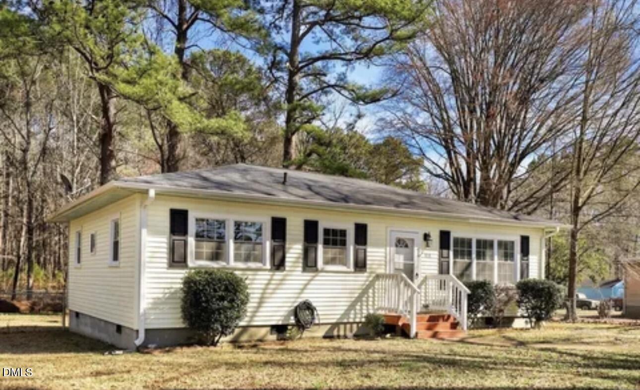 810 Milton Road Durham, NC 27712 - Photo 2 of 21 a view of a white house with a large windows