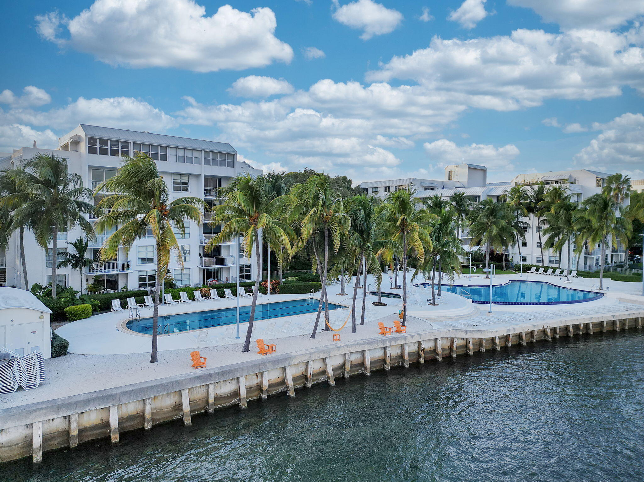 777 Northeast 62nd Street, Unit C512 Miami, FL 33138 - Photo 1 of 40 a view of a swimming pool and lounge chairs