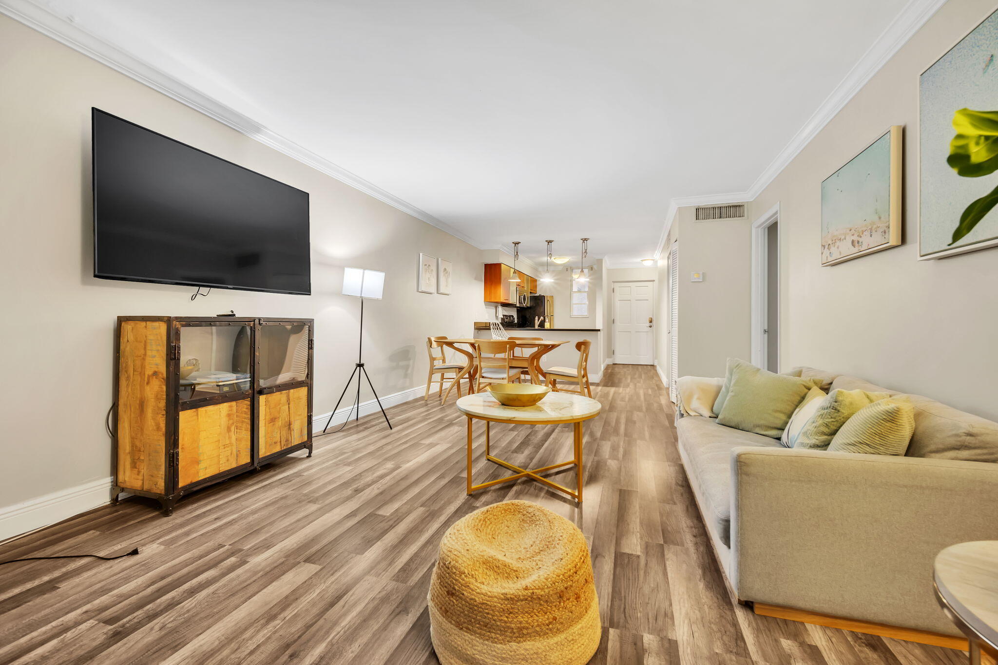 777 Northeast 62nd Street, Unit C512 Miami, FL 33138 - Photo 14 of 40 a living room with furniture and a flat screen tv