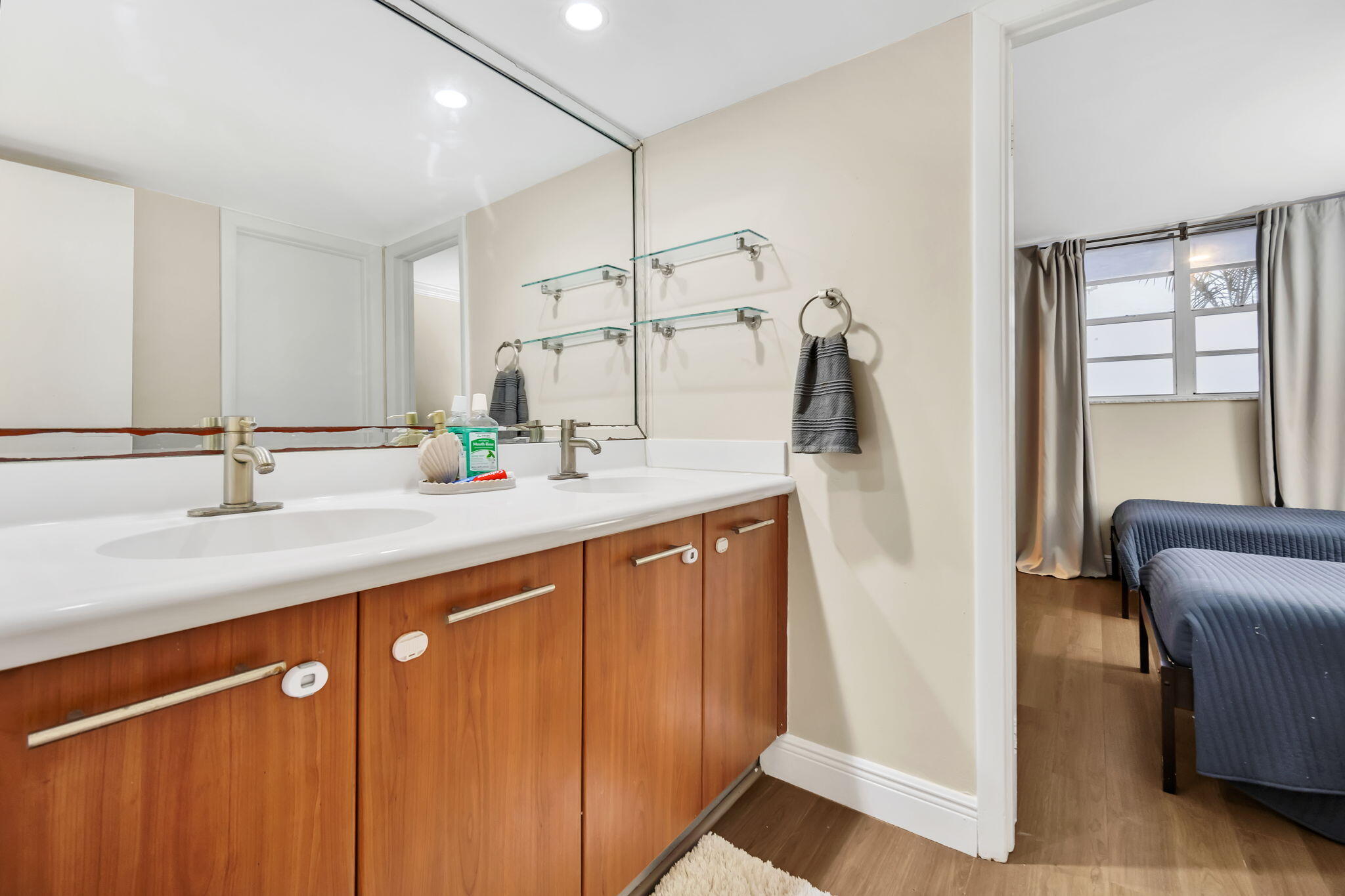 777 Northeast 62nd Street, Unit C512 Miami, FL 33138 - Photo 22 of 40 a bathroom with a sink and a mirror