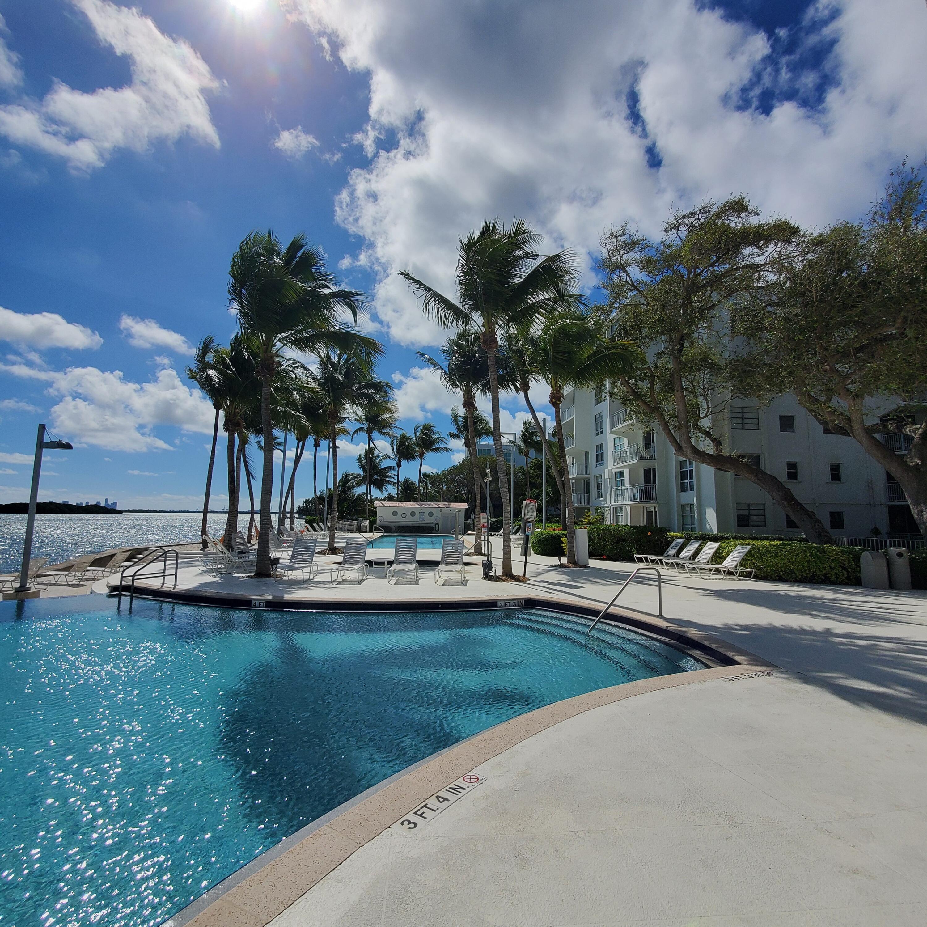 777 Northeast 62nd Street, Unit C512 Miami, FL 33138 - Photo 37 of 40 a view of a swimming pool and outdoor space