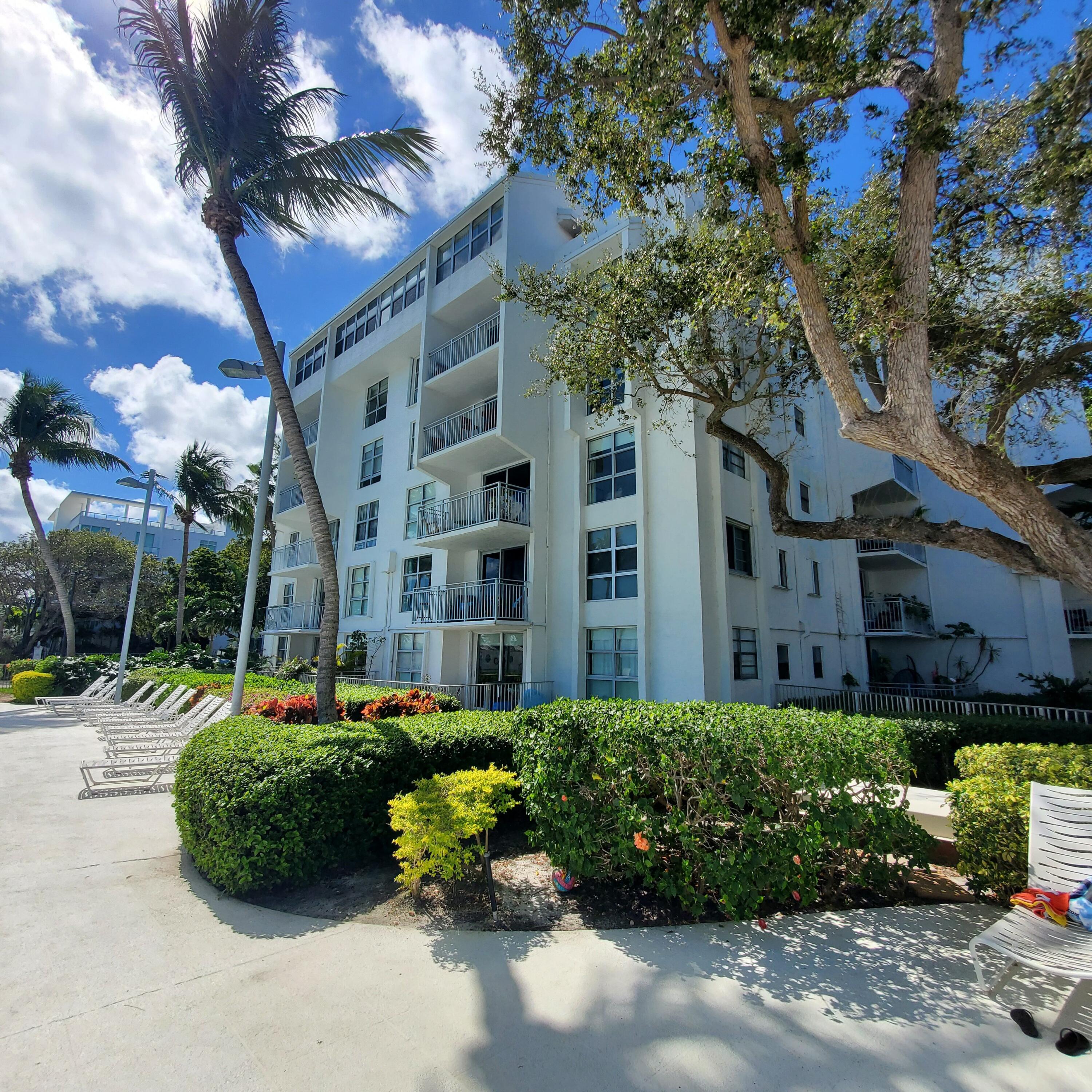 777 Northeast 62nd Street, Unit C512 Miami, FL 33138 - Photo 38 of 40 a front view of a building with garden