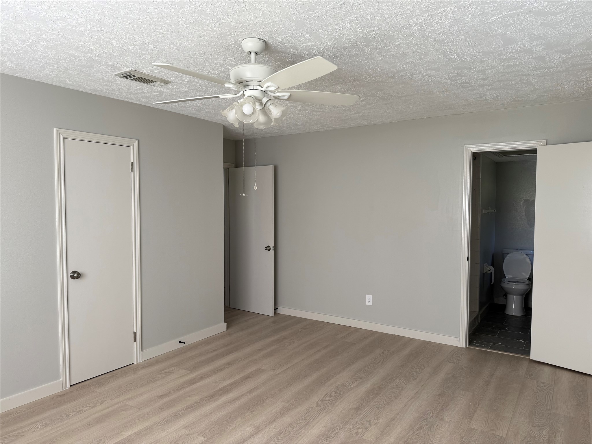 5622 Killough Street Houston, TX 77086 - Photo 13 of 21 a view of an empty room with wooden floor