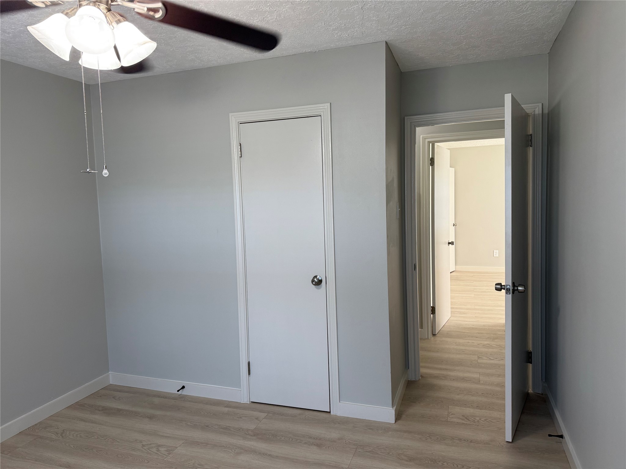 5622 Killough Street Houston, TX 77086 - Photo 15 of 21 an empty room with wooden floor and mirror