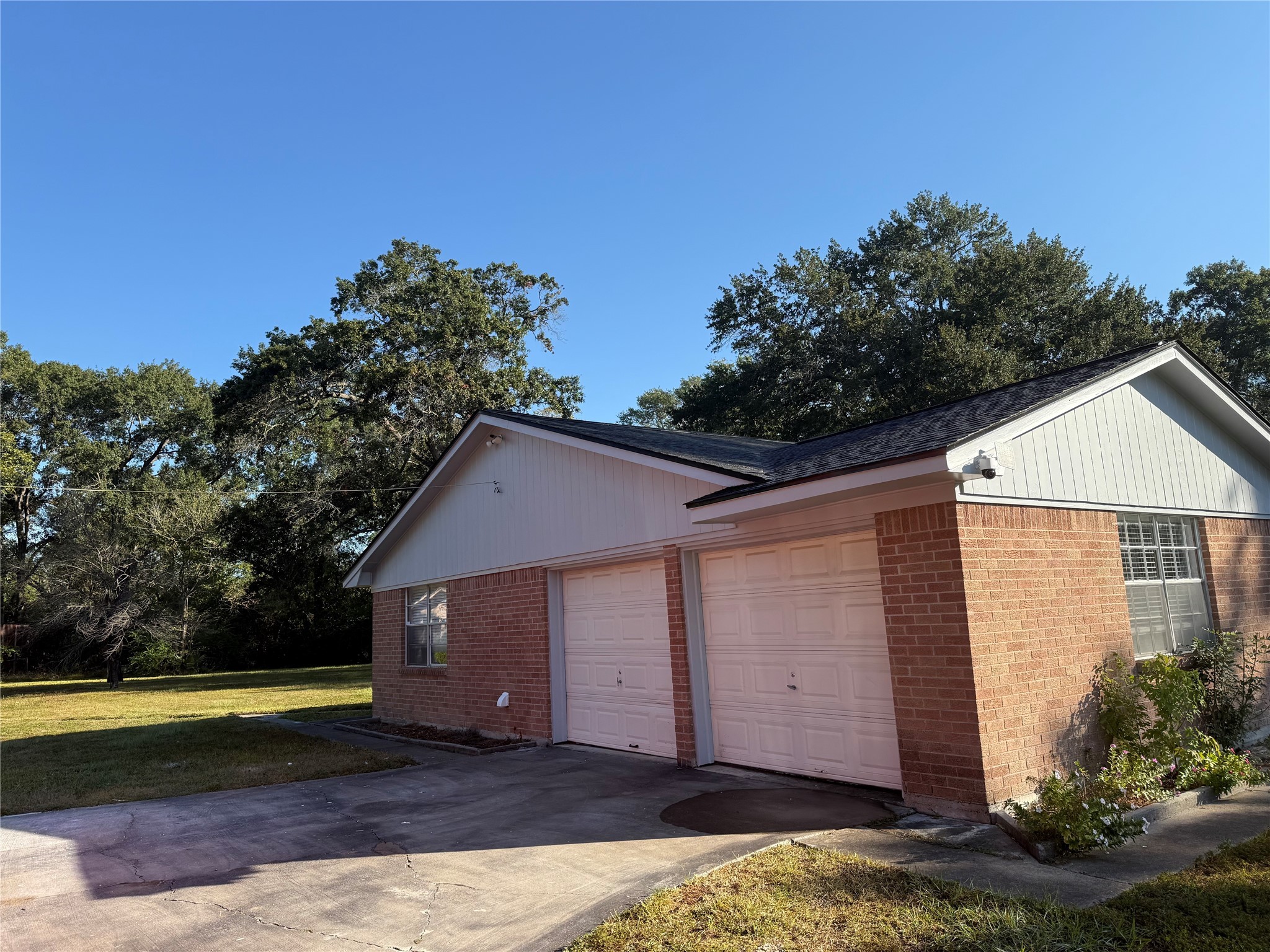 5622 Killough Street Houston, TX 77086 - Photo 19 of 21 a front view of house with yard and trees in the background