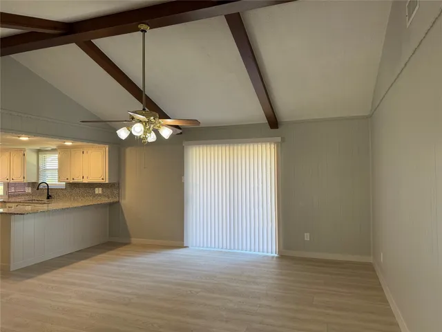 a view of a kitchen with a sink and dishwasher