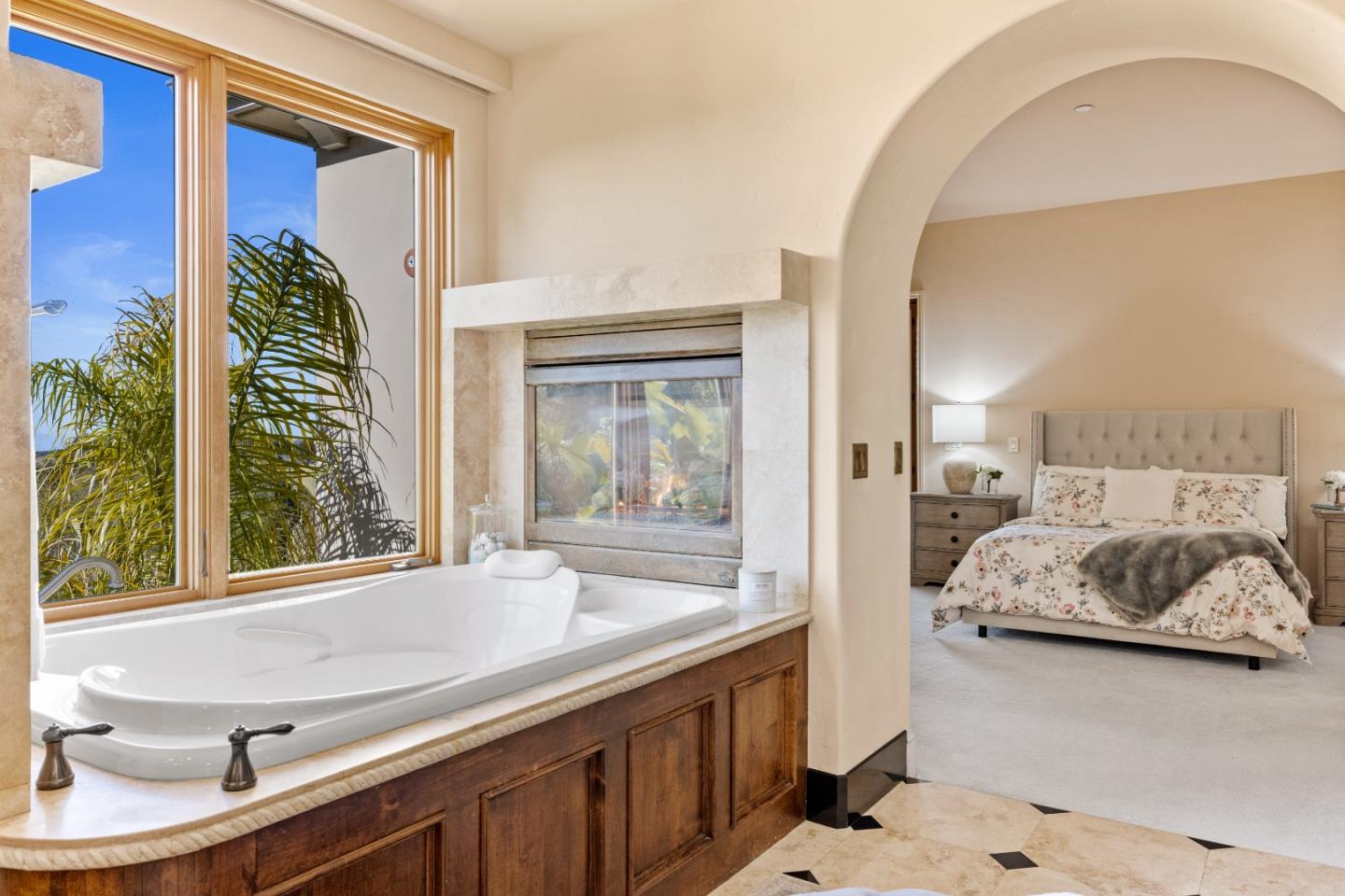 11550 Spur Road Monterey, CA 93940 - Photo 29 of 60 a en suite bathroom with a granite countertop tub and a large window