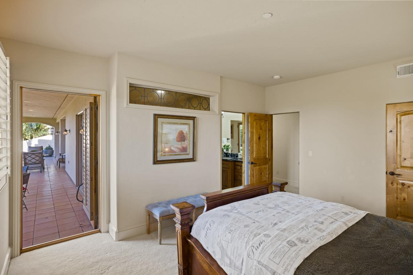 11550 Spur Road Monterey, CA 93940 - Photo 37 of 60 a bedroom with a bed and a large mirror