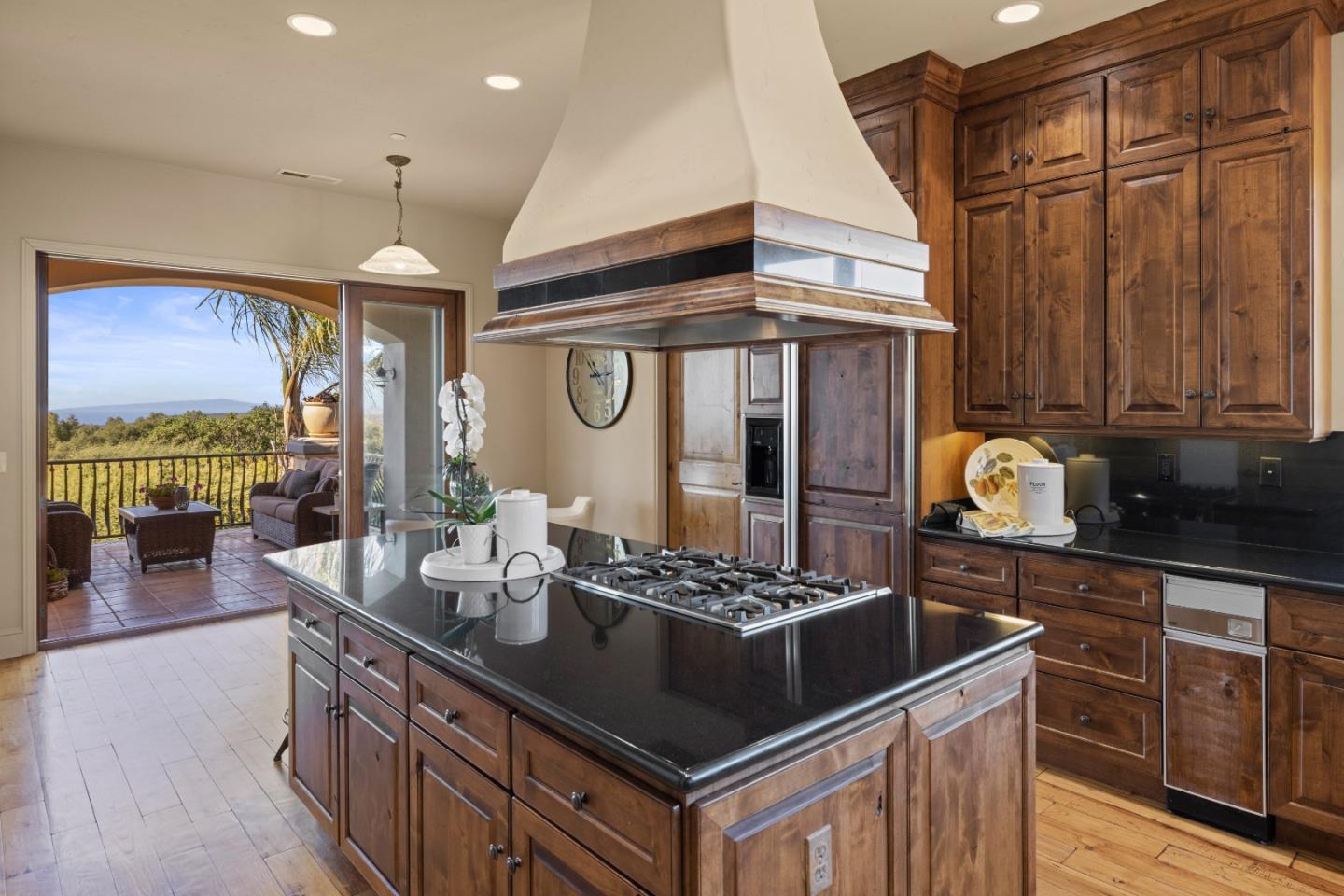 11550 Spur Road Monterey, CA 93940 - Photo 51 of 60 a kitchen with stainless steel appliances granite countertop a stove and a wooden cabinets