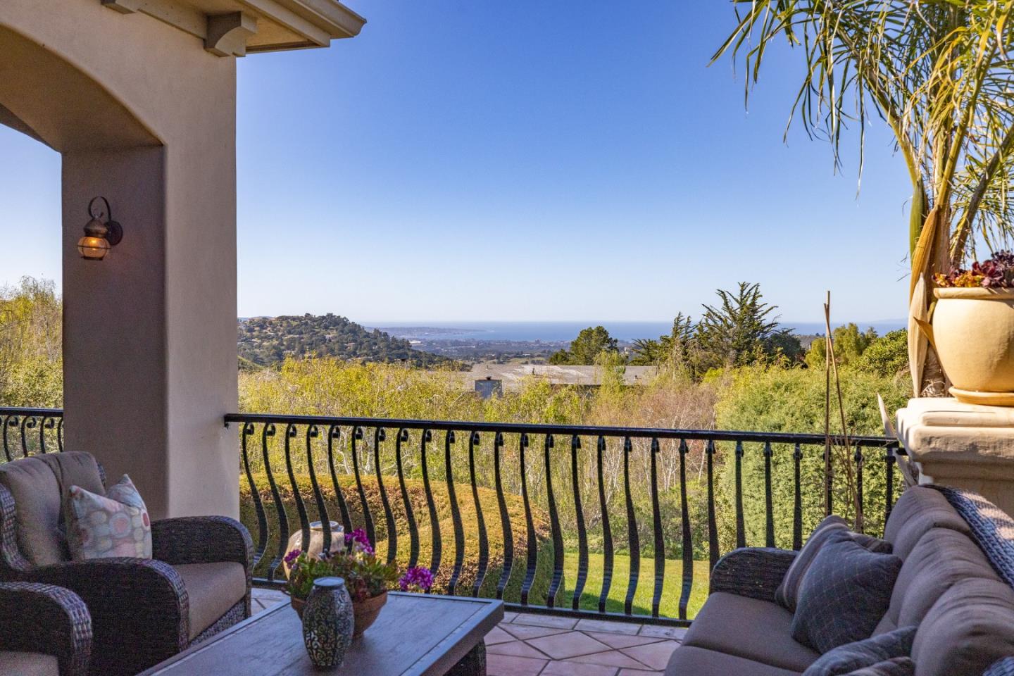 11550 Spur Road Monterey, CA 93940 - Photo 10 of 60 a balcony with furniture and a potted plant