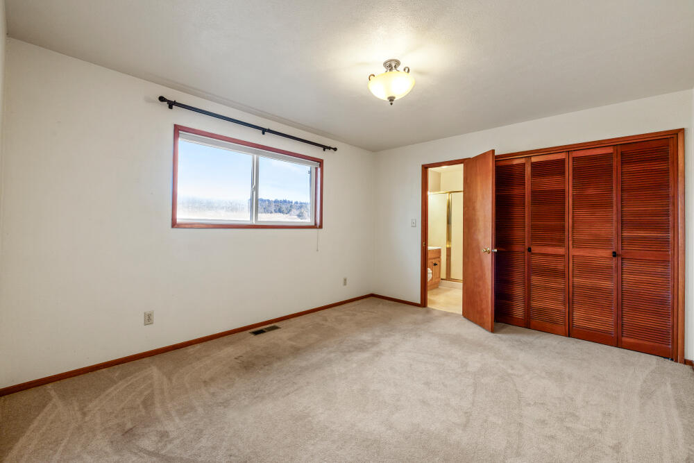 23131 North Poe Valley Road Klamath Falls, OR 97603 - Photo 21 of 45 an empty room with a empty space & windows