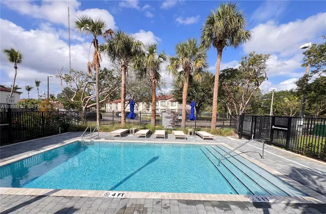 a view of a yard with cars