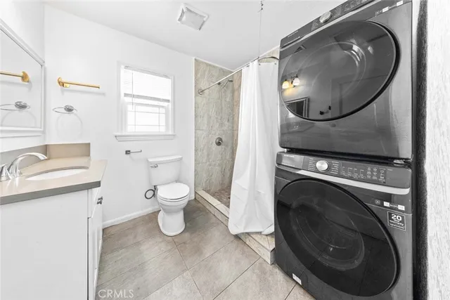 a bathroom with a toilet a sink and a mirror