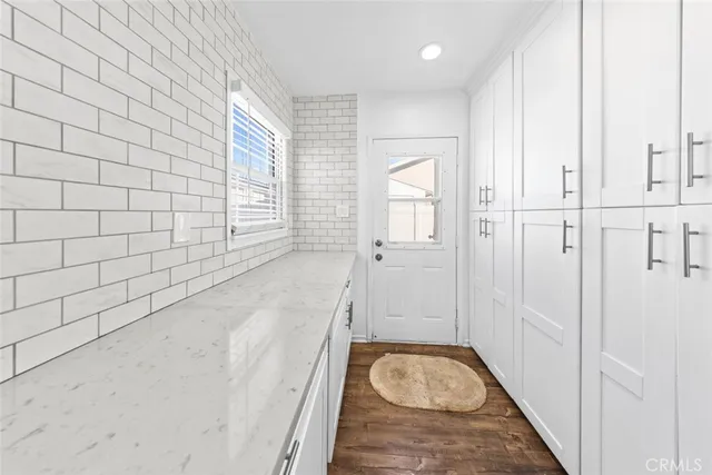a bathroom with a granite countertop shower
