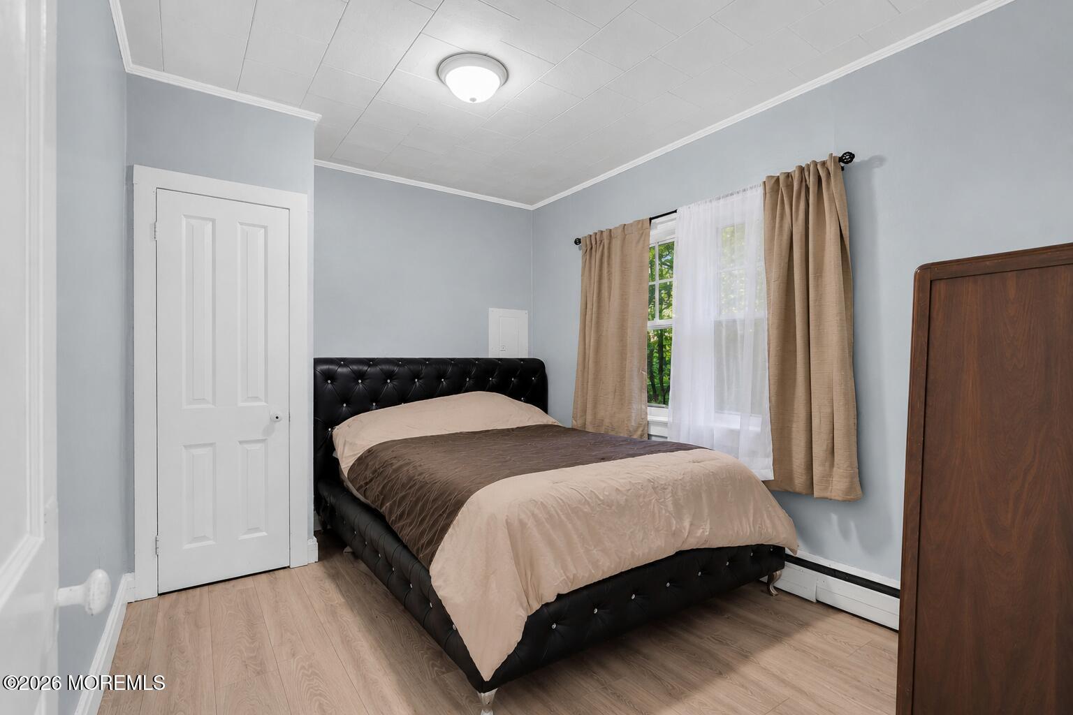269 Alexander Avenue Howell, NJ 07731 - Photo 21 of 43 a bedroom with a bed and wooden floor