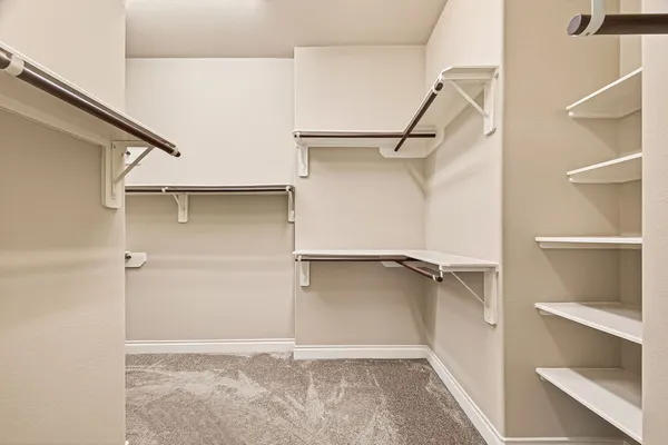 a view of an empty walk in closet