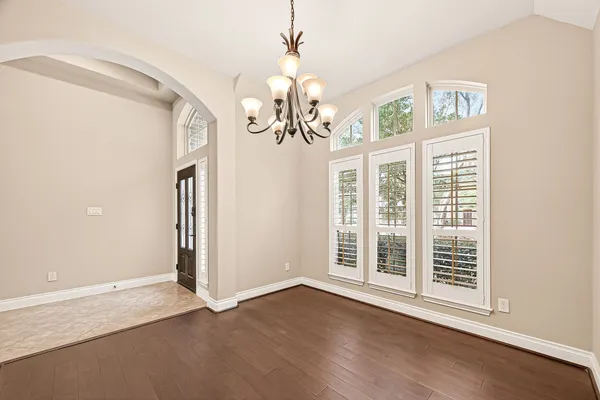 a view of a livingroom with a ceiling fan and window