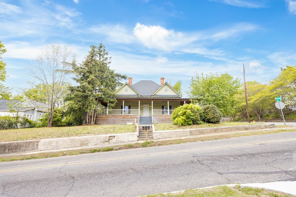 2113 Summerville Road Phenix City, AL 36867 - Photo 5 of 37 a front view of a house with a garden and pathway