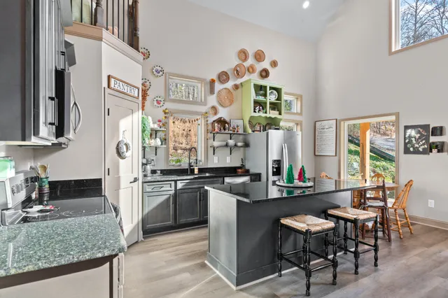 a view of a dining room with furniture and a window