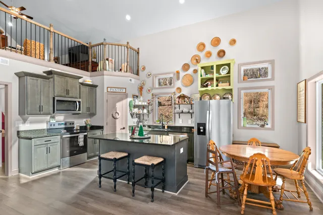 a view of a dining room with furniture and a potted plant