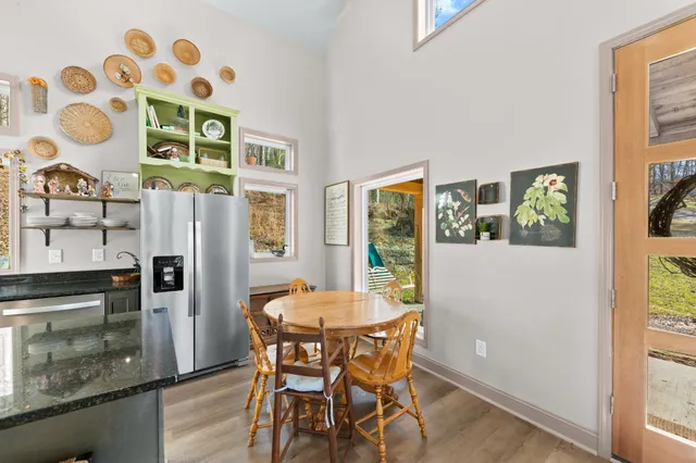 a kitchen with stainless steel appliances a stove top oven a sink and a refrigerator