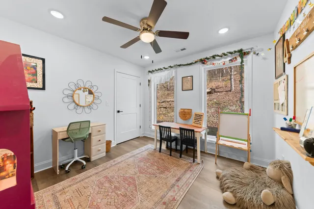 a room with furniture and a potted plant