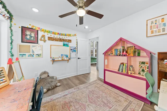 a living room with furniture or couch and a wooden floor