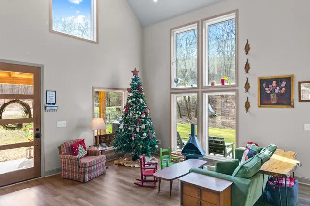 a living room with furniture and wooden floor