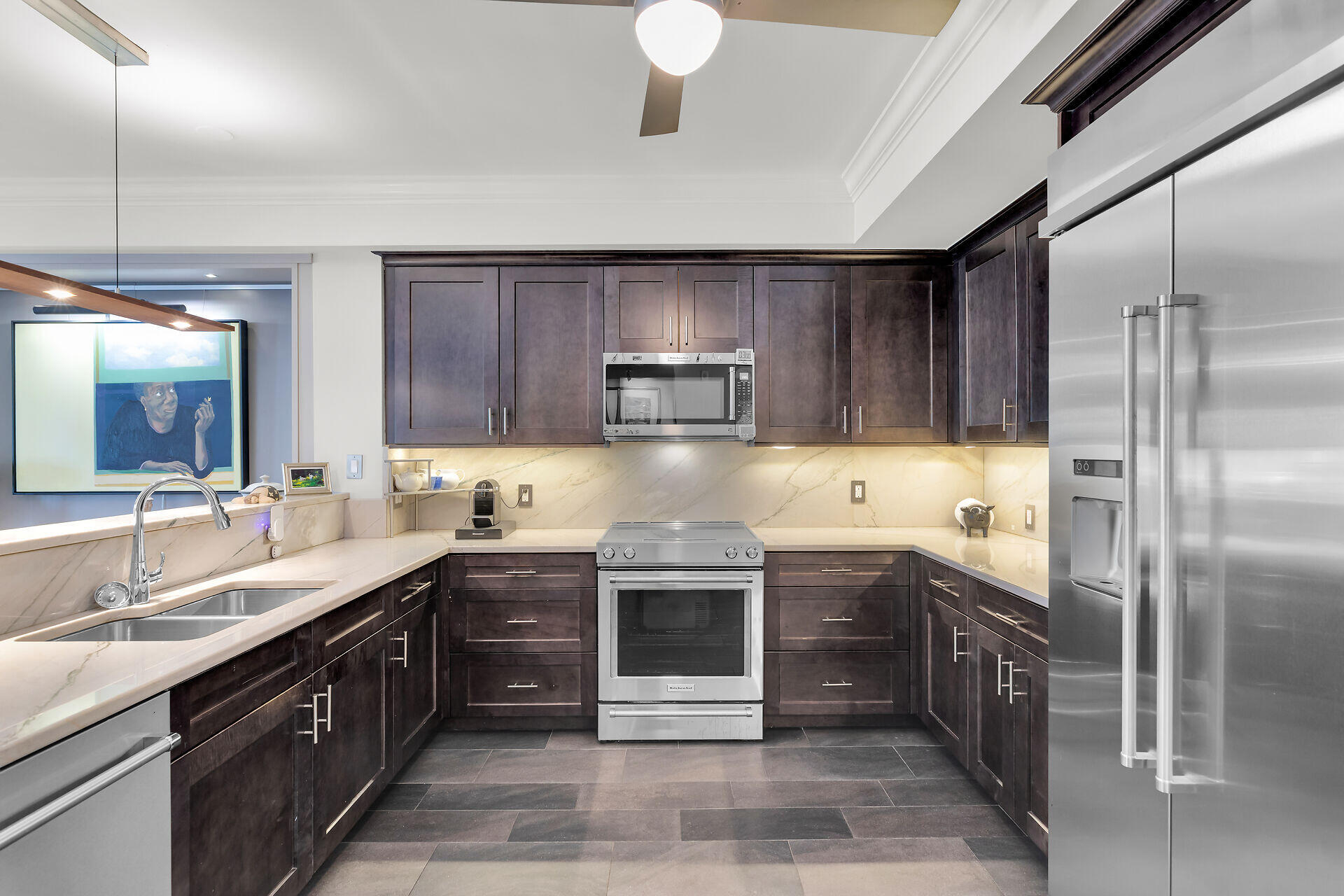 141 Simonton Street Key West, FL 33040 - Photo 5 of 49 a kitchen with stainless steel appliances granite countertop a sink and a stove