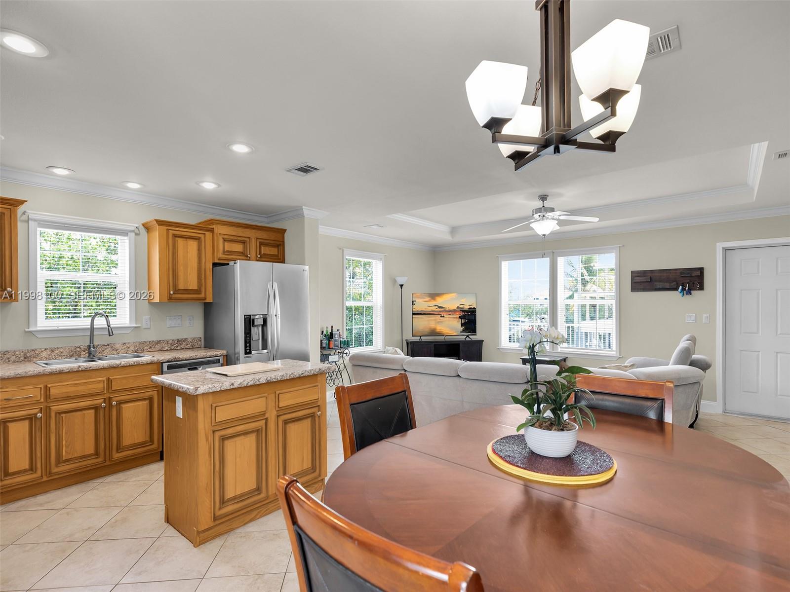 437 Pirates Road Summerland Key, FL 33042 - Photo 20 of 39 a kitchen with a table and chairs