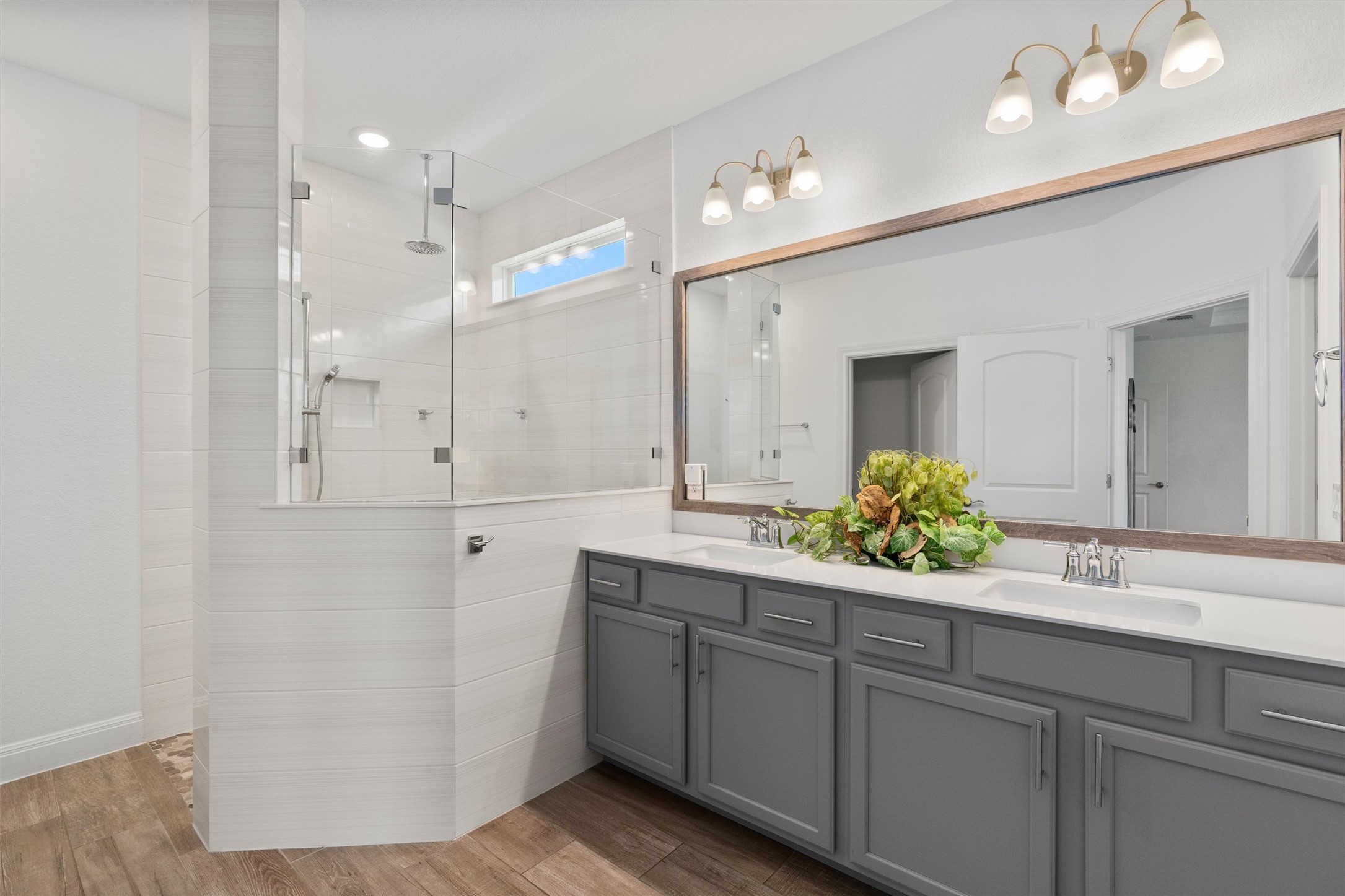 202 Spanish Star Street Georgetown, TX 78633 - Photo 19 of 32 a bathroom with a double vanity sink and a mirror