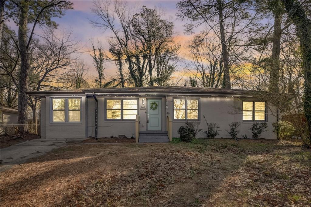 1268 Tacoma Way Decatur, GA 30032 - Photo 1 of 1 a front view of house with yard and trees around
