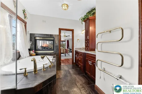 a bathroom with a toilet a sink and a mirror