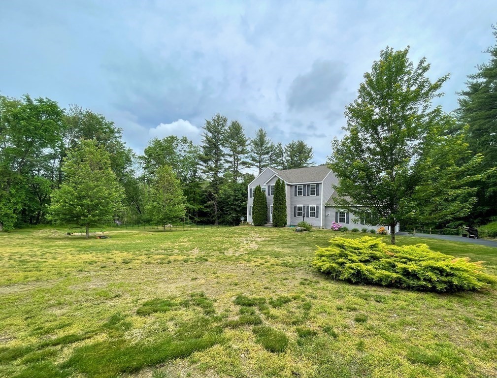 149 Groton Road Shirley, MA 01464 - Photo 31 of 32 a front view of a house with a garden