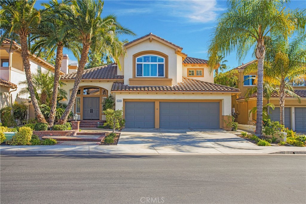 a view of multiple houses with a street