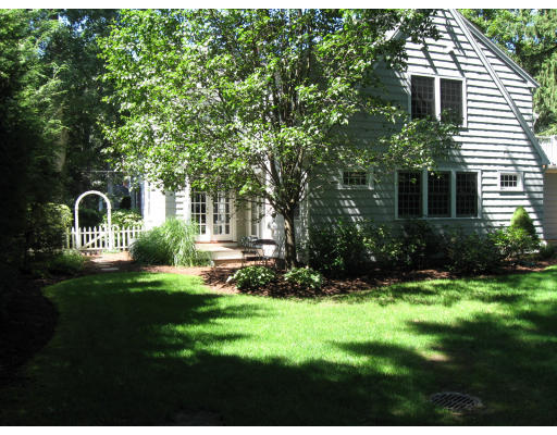 40 Emerson Road Wellesley, MA 02481 - Photo 7 of 9 a front view of a house with a yard and trees