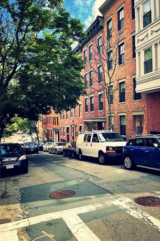 18 Grove Street, Unit 4 Boston, MA 02114 - Photo 16 of 17 a view of street with parked cars