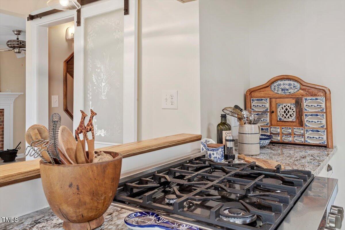 7120 Sandringham Drive Raleigh, NC 27613 - Photo 16 of 40 a living room with furniture and a rug