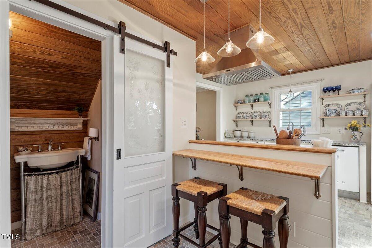 7120 Sandringham Drive Raleigh, NC 27613 - Photo 21 of 40 a kitchen with a refrigerator and countertop