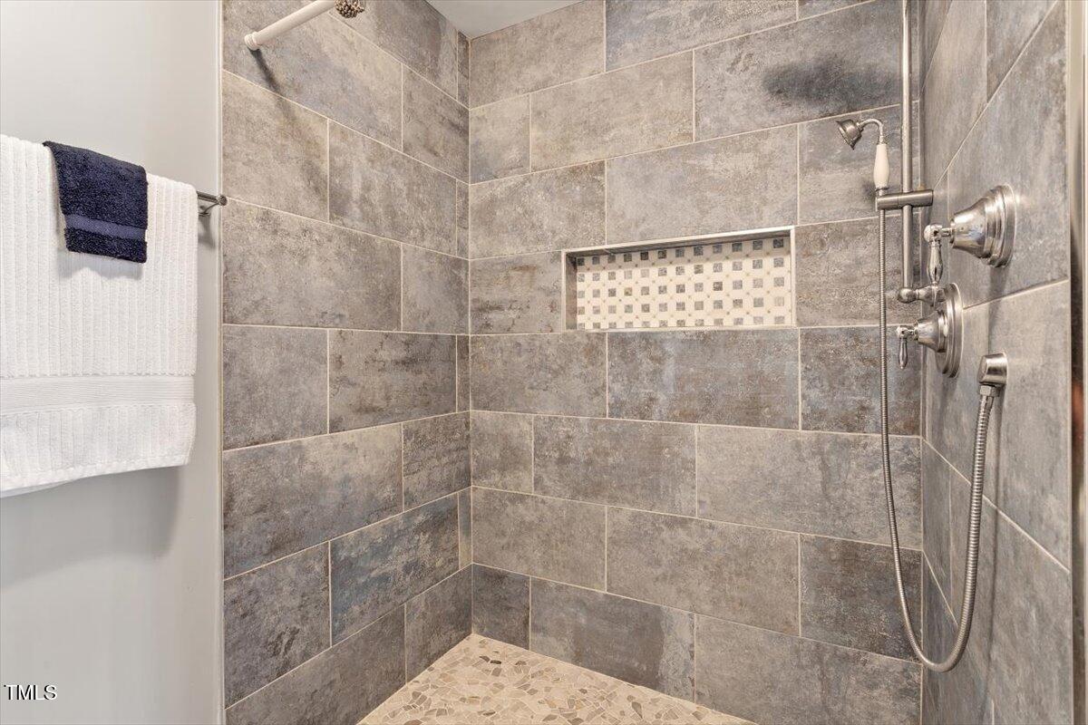 7120 Sandringham Drive Raleigh, NC 27613 - Photo 26 of 40 a bathroom with a shower