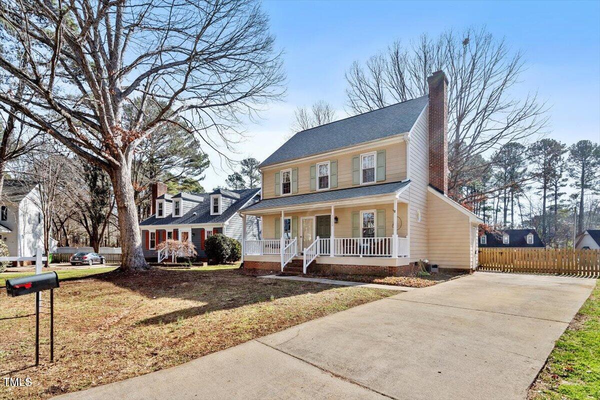 7120 Sandringham Drive Raleigh, NC 27613 - Photo 2 of 40 a front view of a house with a yard