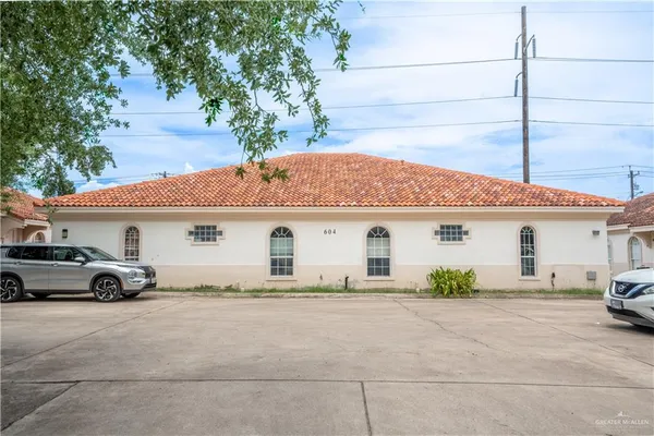 a view of a car park in front of house