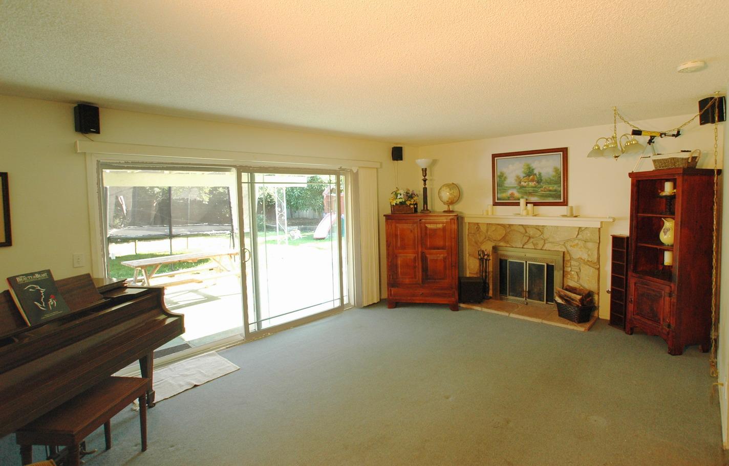 5629 Berkeley Road Goleta, CA 93117 - Photo 3 of 6 a living room with furniture and a fireplace