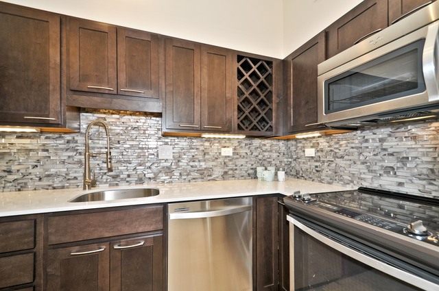 175 East Delaware Place, Unit 4619 Chicago, IL 60611 - Photo 5 of 10 a kitchen with granite countertop a sink cabinets and stainless steel appliances