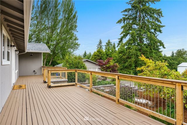 a view of a balcony with chairs