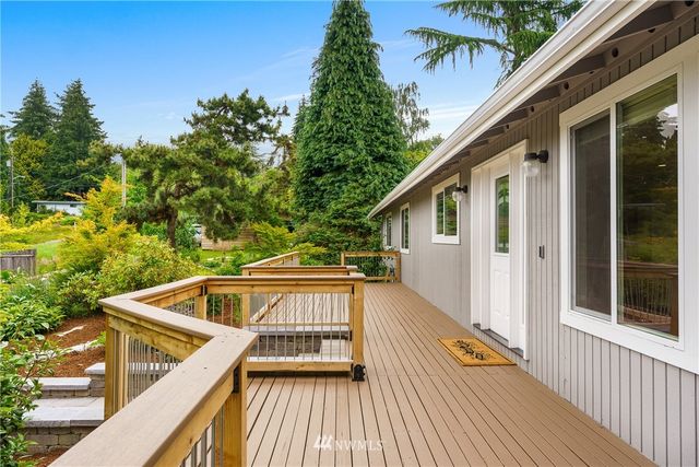 a view of balcony with wooden floor and outdoor space
