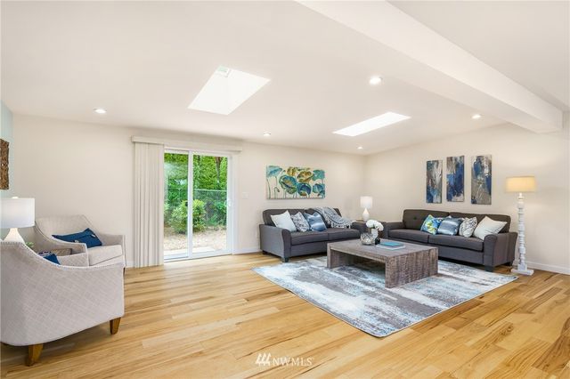 a living room with furniture and a rug